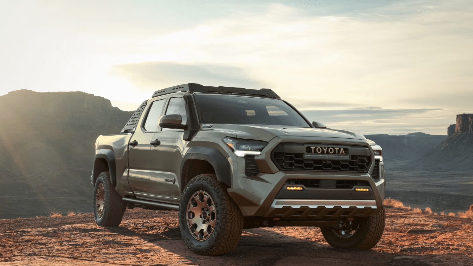 Toyota Tacoma parked outside and atop a rock bed