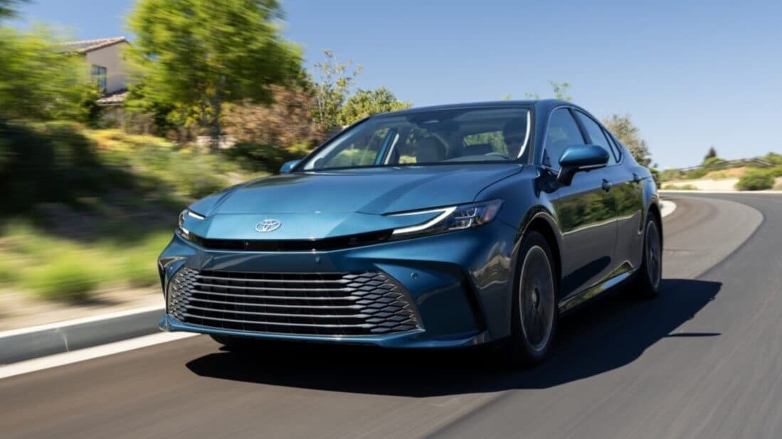 Ocean Gem Toyota Camry driving down a road