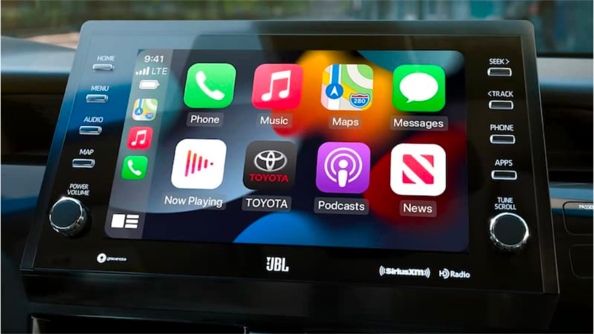Interior view of a Toyota with frame filled by screen displaying Apple CarPlay UI