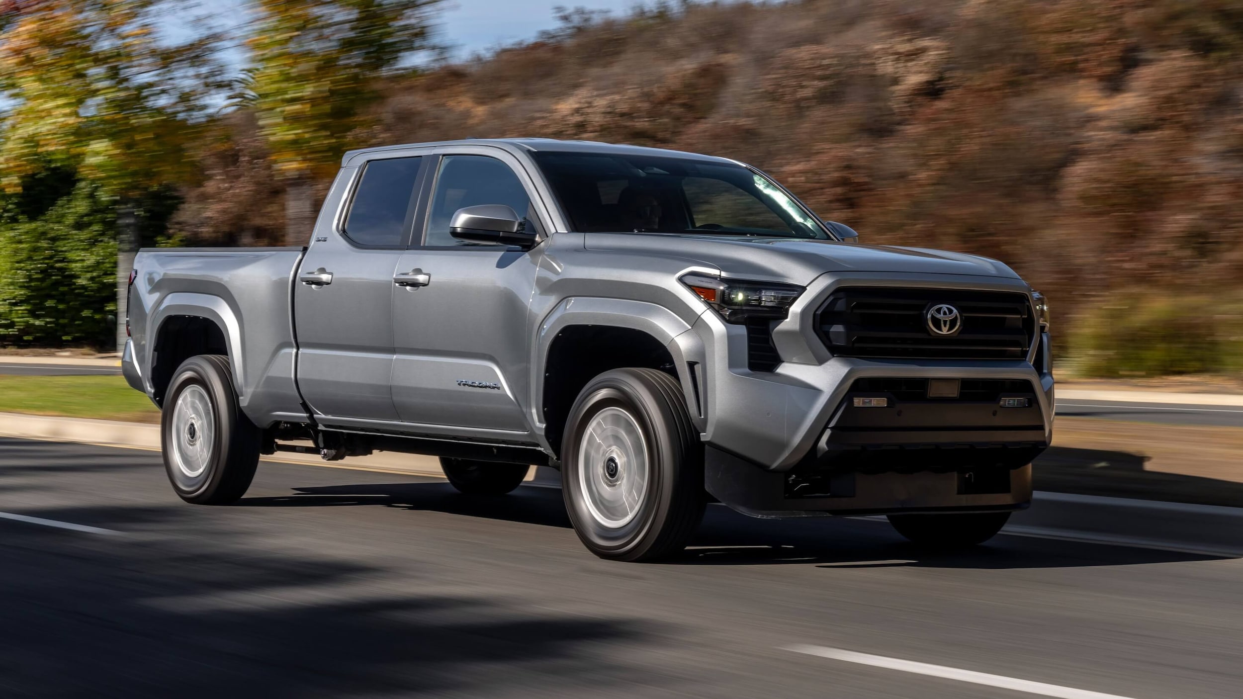 Exterior shot of a Toyota Tacoma SR5 driving down a road