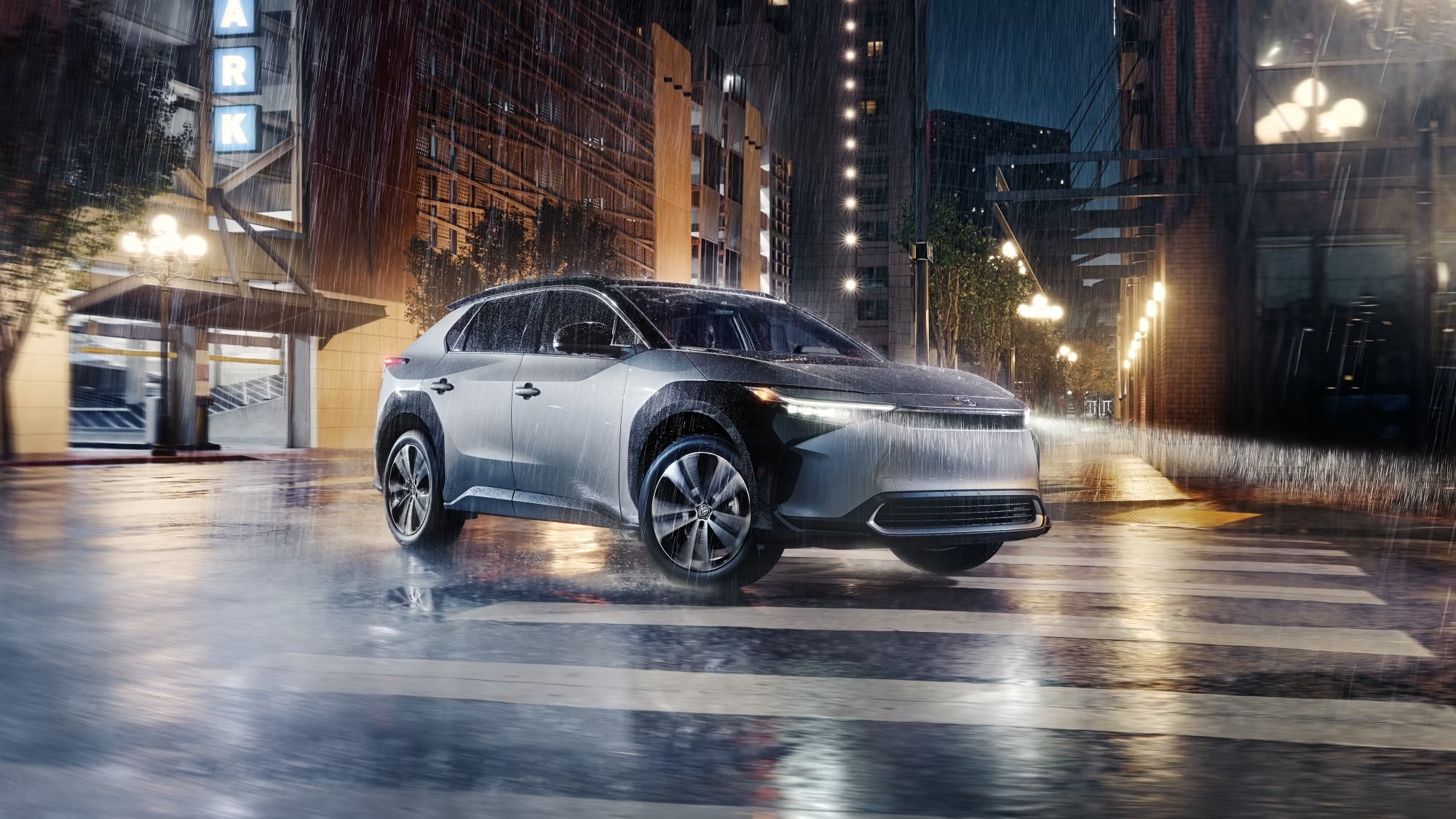 Toyota bz4X driving outside in the rain