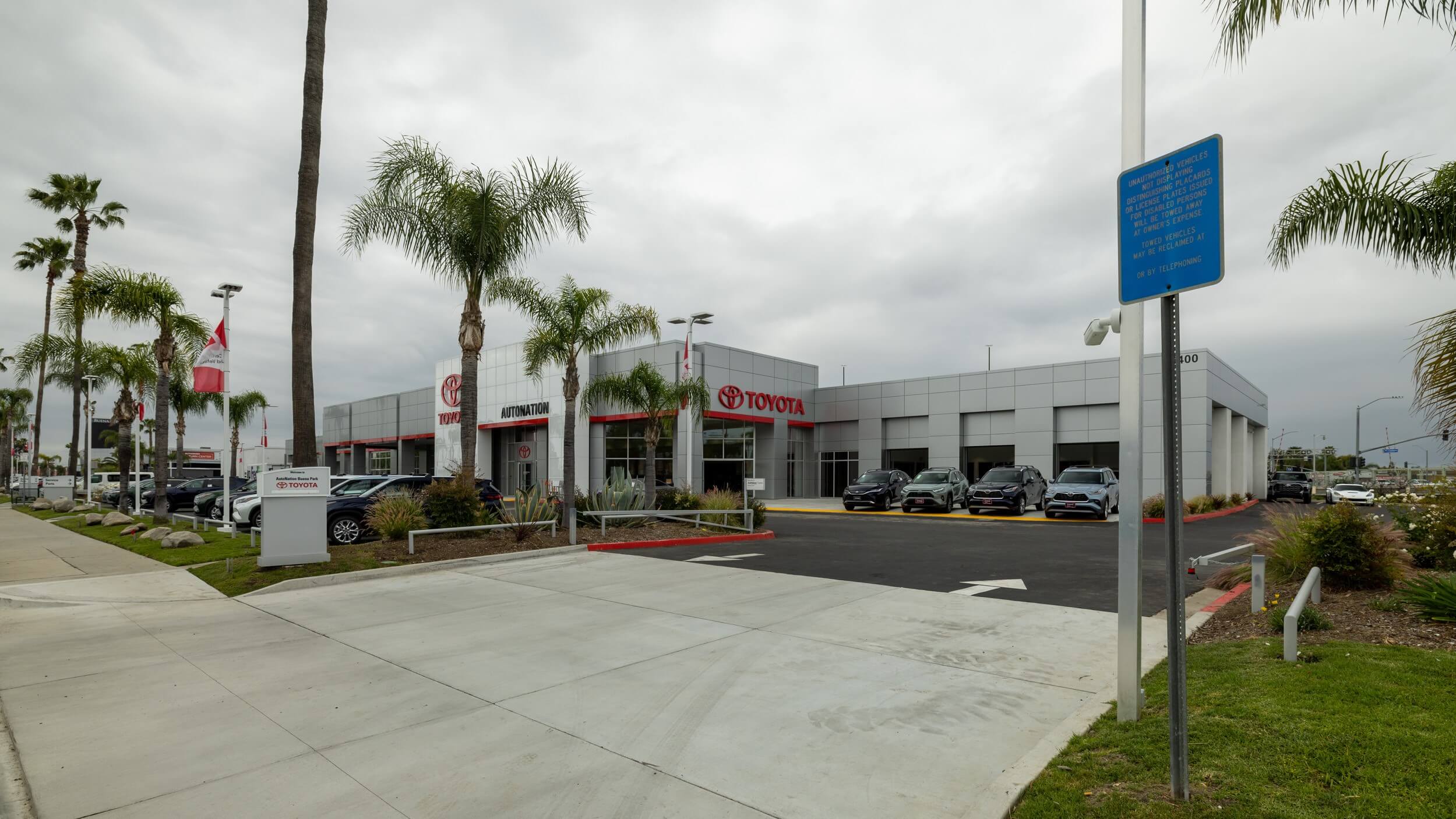 Exterior view of AutoNation Toyota Buena Park's driveway, cars parked on the lot