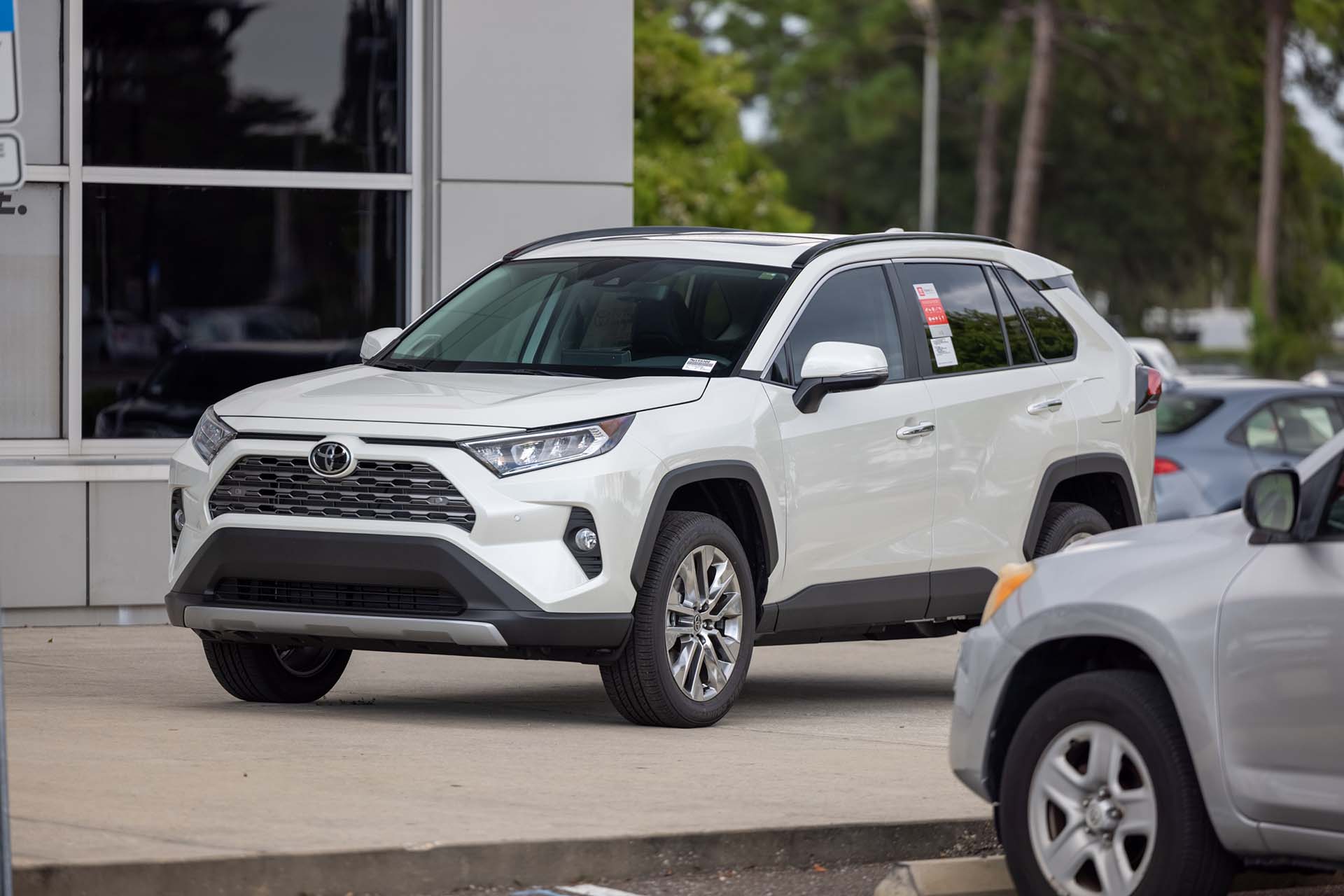 White Toyota parked outside lobby at AutoNation Toyota Pinellas Park