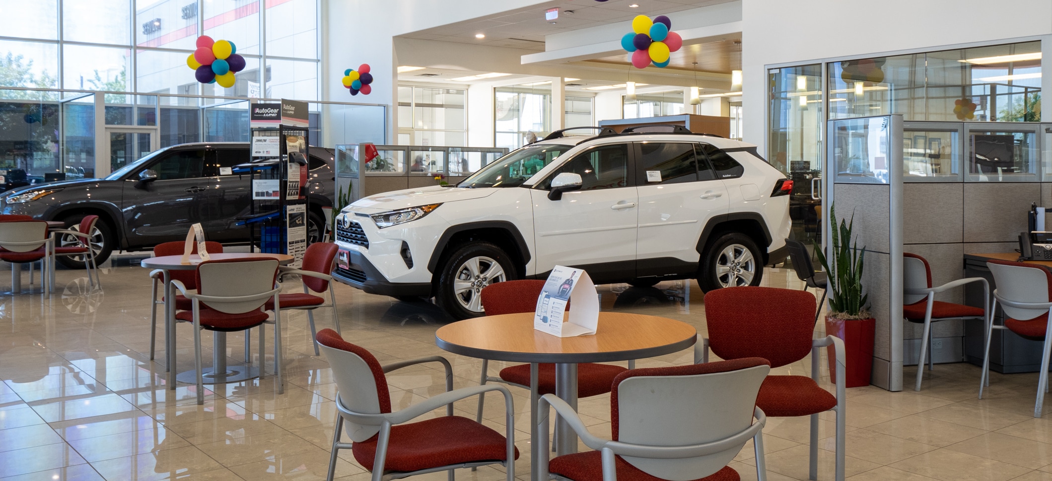 White Toyota parked in the lobby of AutoNation Toyota Gulf Freeway