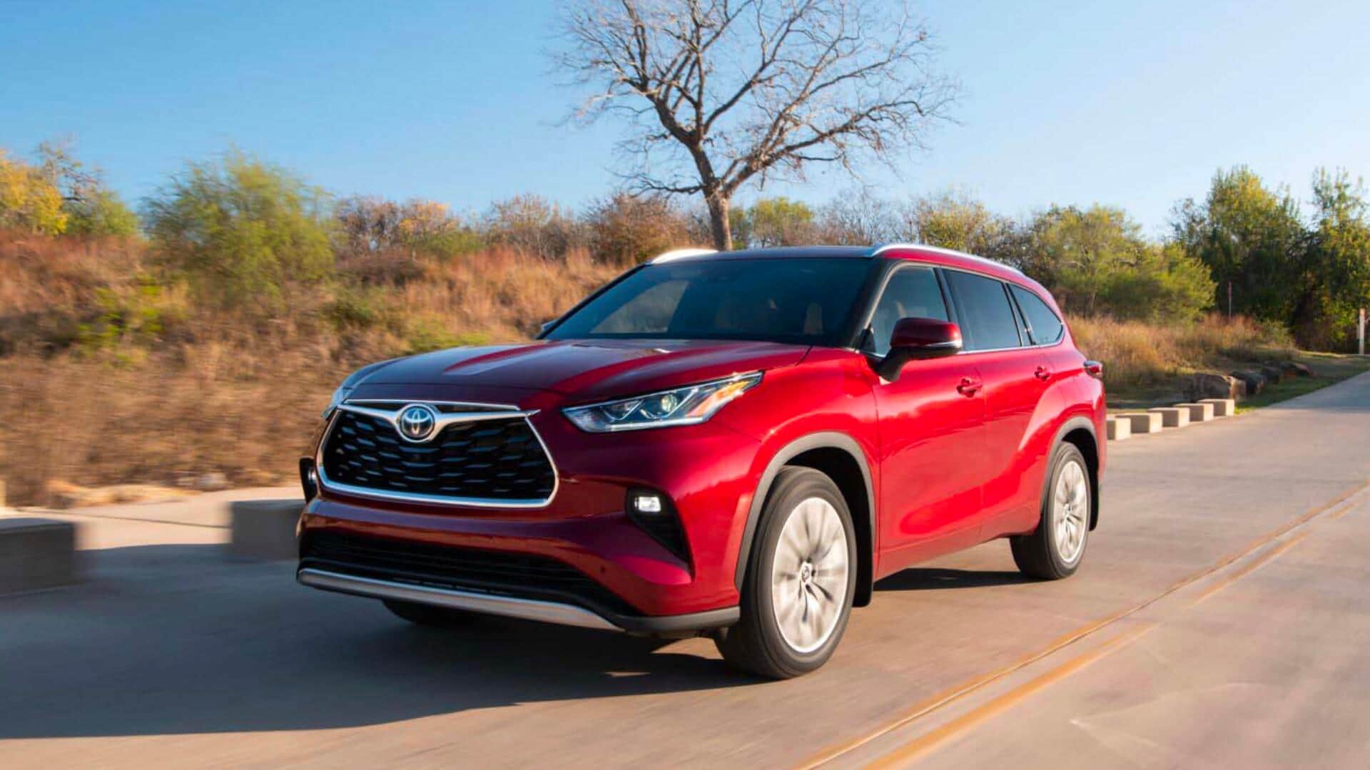 Visit an AutoNation USA Location near you to check out our used Toyota Highlander Hybrid  inventory Toyota Highlander Hybrid driving on a road