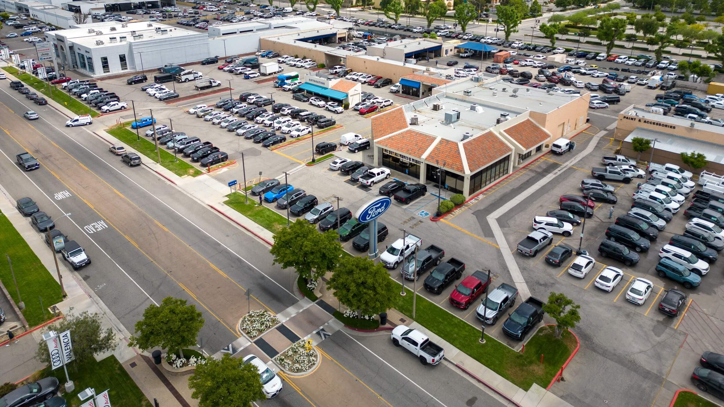 AutoNation Ford dealership in Valencia, CA Exterior view of AutoNation Ford Valencia, shot from a drone