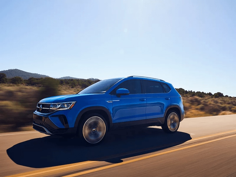 VW Taos driving down the road