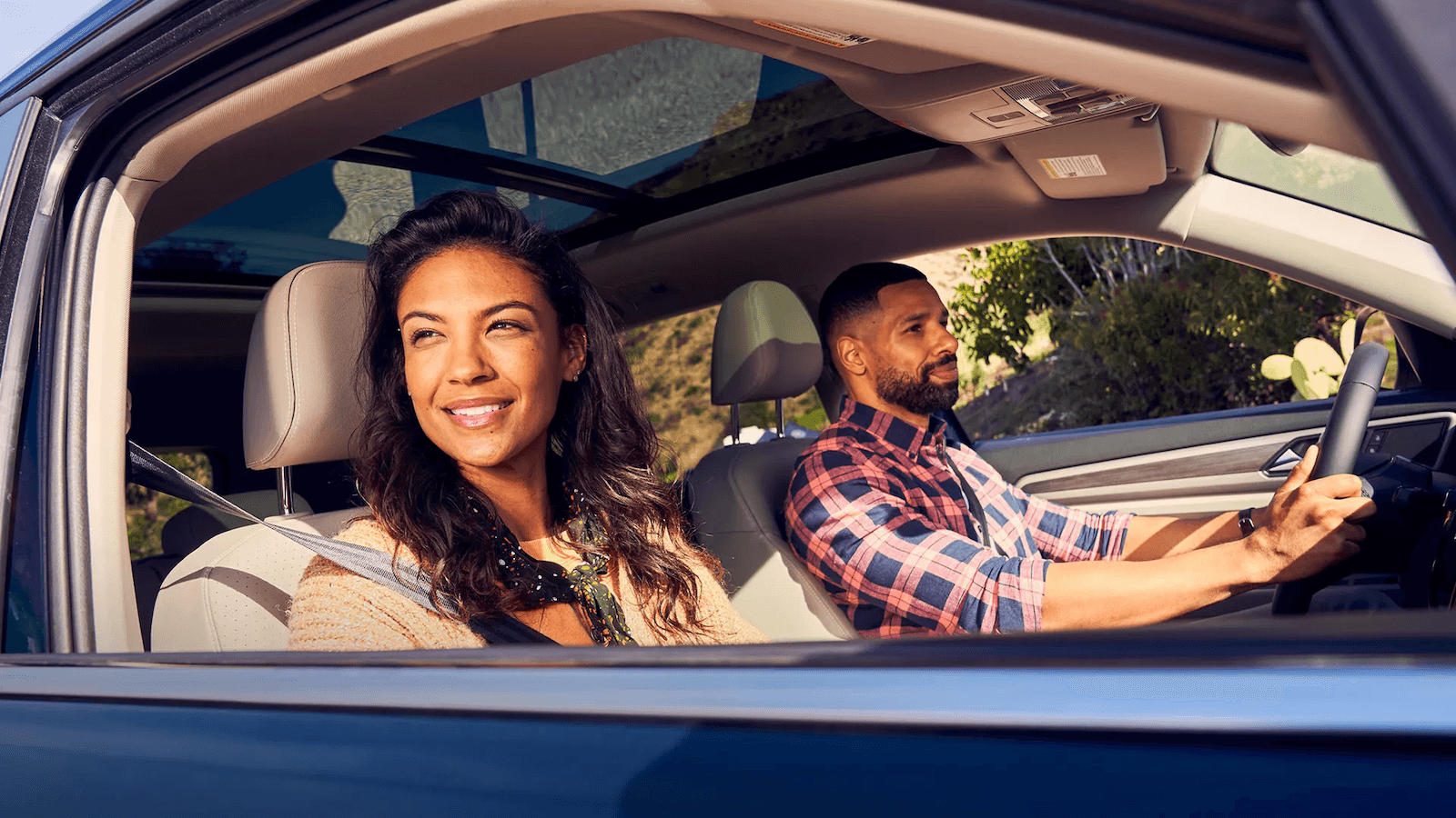 Happy couple in a new Volkswagen