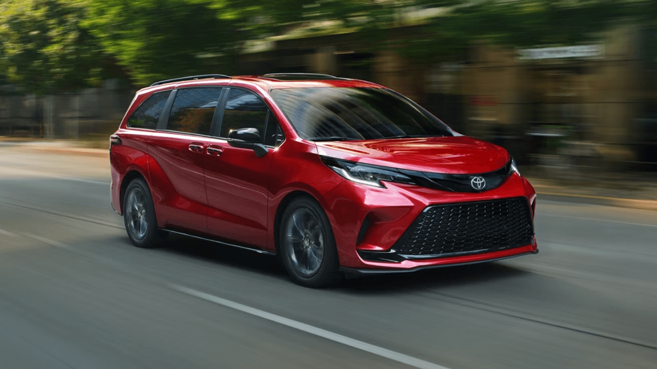Toyota Sienna driving down