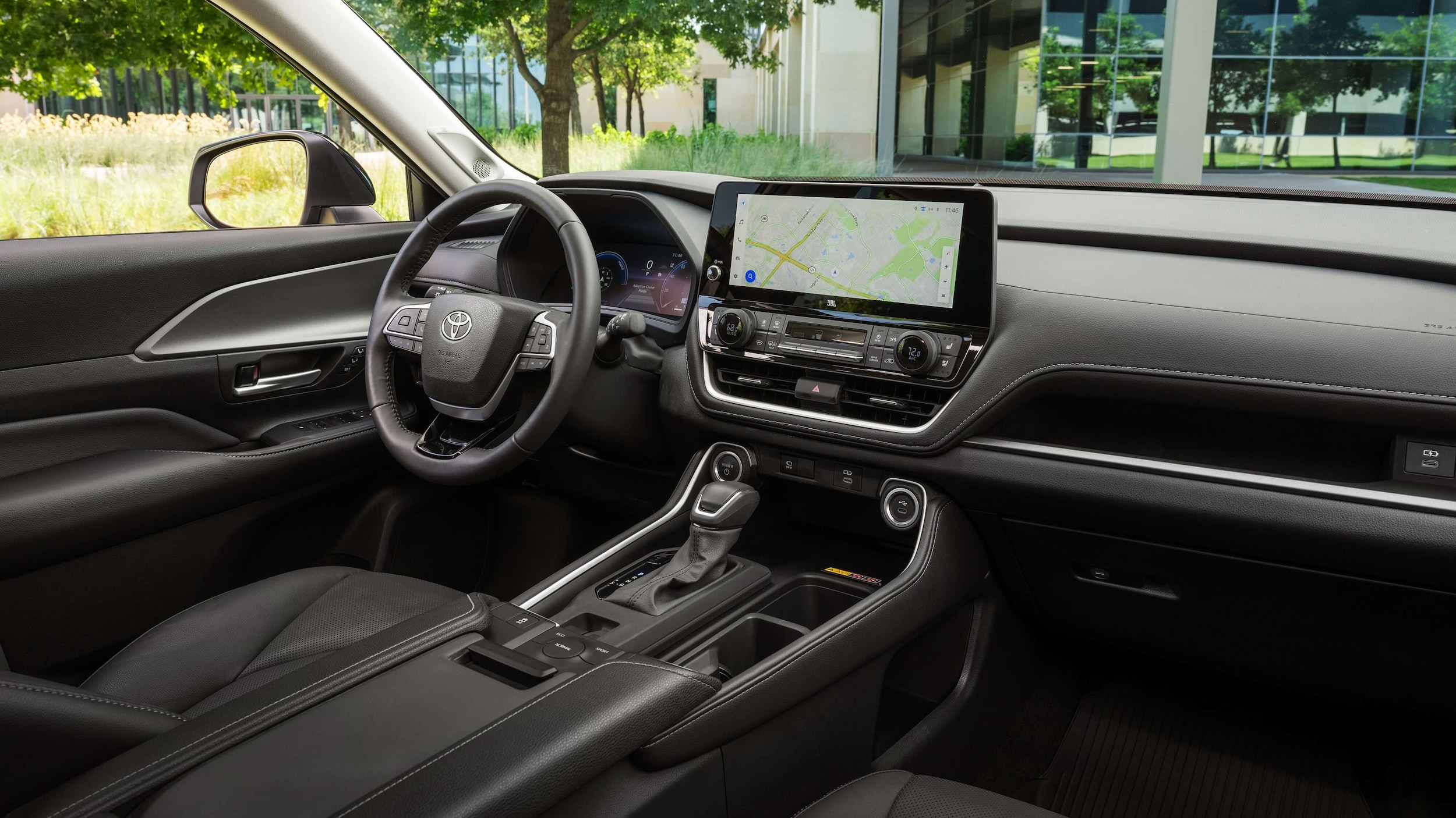 The steering wheel and center consol of the Grand Highlander