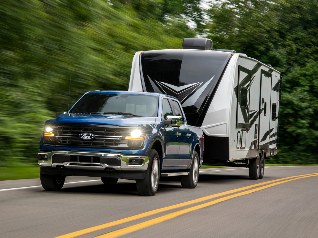 2026 Ford F-150 towing a camper van