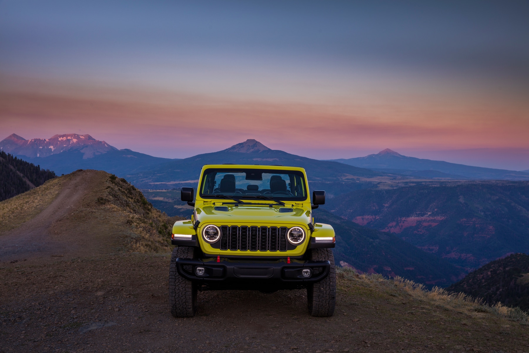 Jeep Gladiator driving at dusk