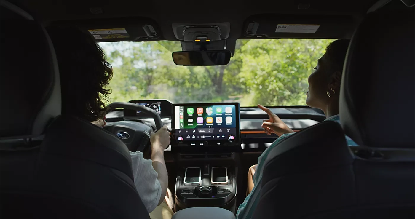 A driver using Intelligent Assistant on the Uncharted touchscreen