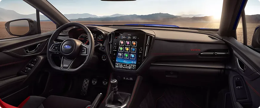 WRX cabin at sunrise showing the dashboard and touchscreen