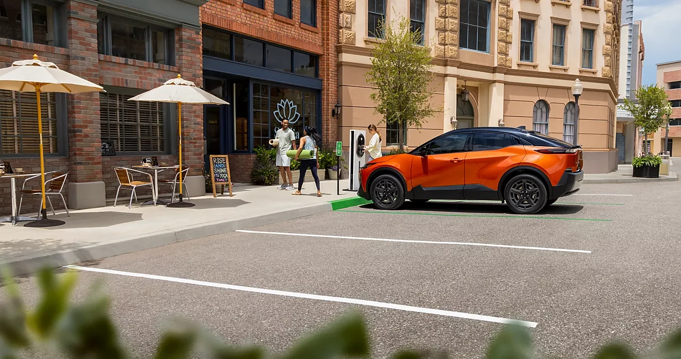 A 2026 Subaru Uncharted at a Tesla Supercharger