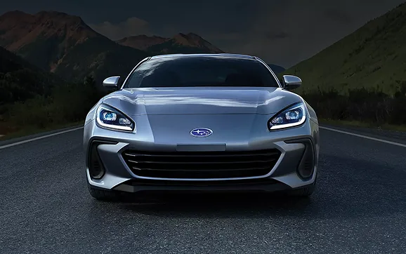 Front view of a light blue Subaru BRZ against a dark backdrop