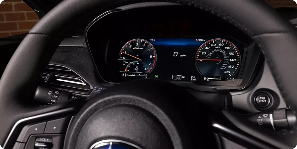 The WRX GT fully digital instrument cluster behind the steering wheel