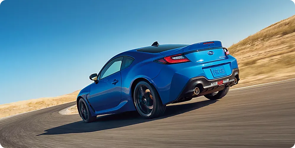 Rear view of a blue Subaru BRZ tS on a desert road
