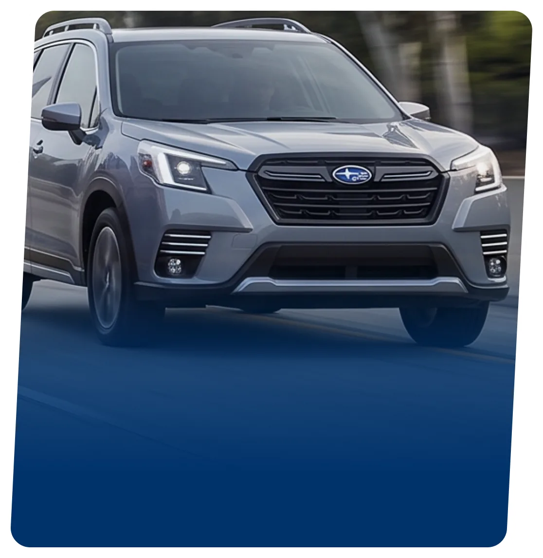 Grey Subaru electric SUV on a blue backdrop