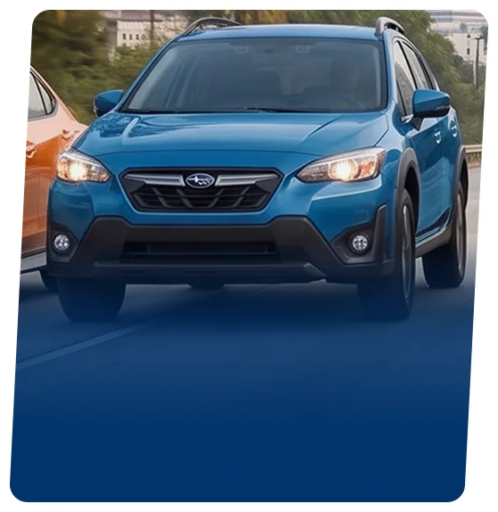 Blue Subaru Crosstrek SUV on a blue backdrop