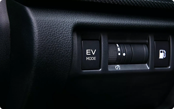 The EV Mode button and drive-mode dial on the center console of a Subaru Crosstrek Hybrid