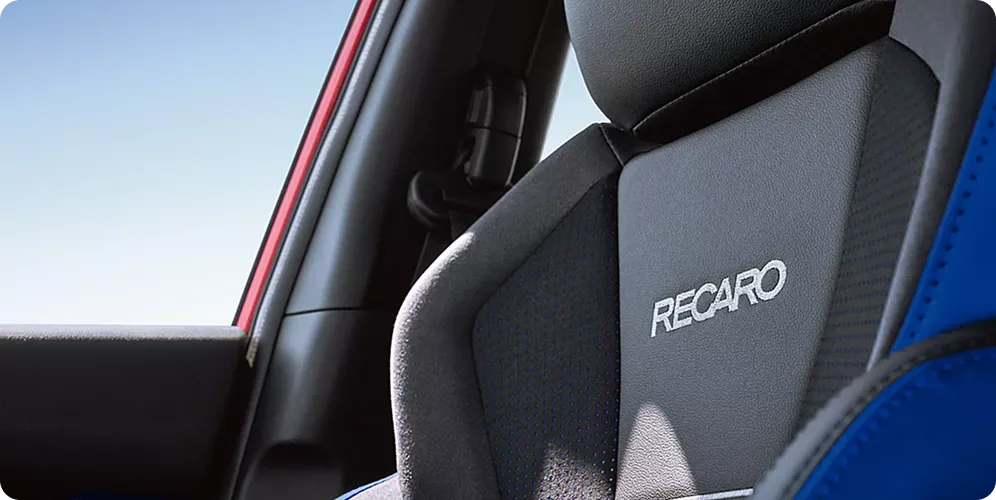 Recaro performance-design front seat inside the blue-trimmed WRX tS