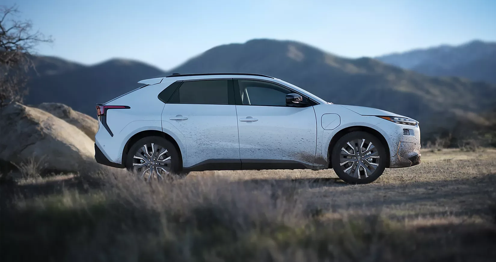 Profile view of a 2026 Subaru Solterra XT with mountains behind