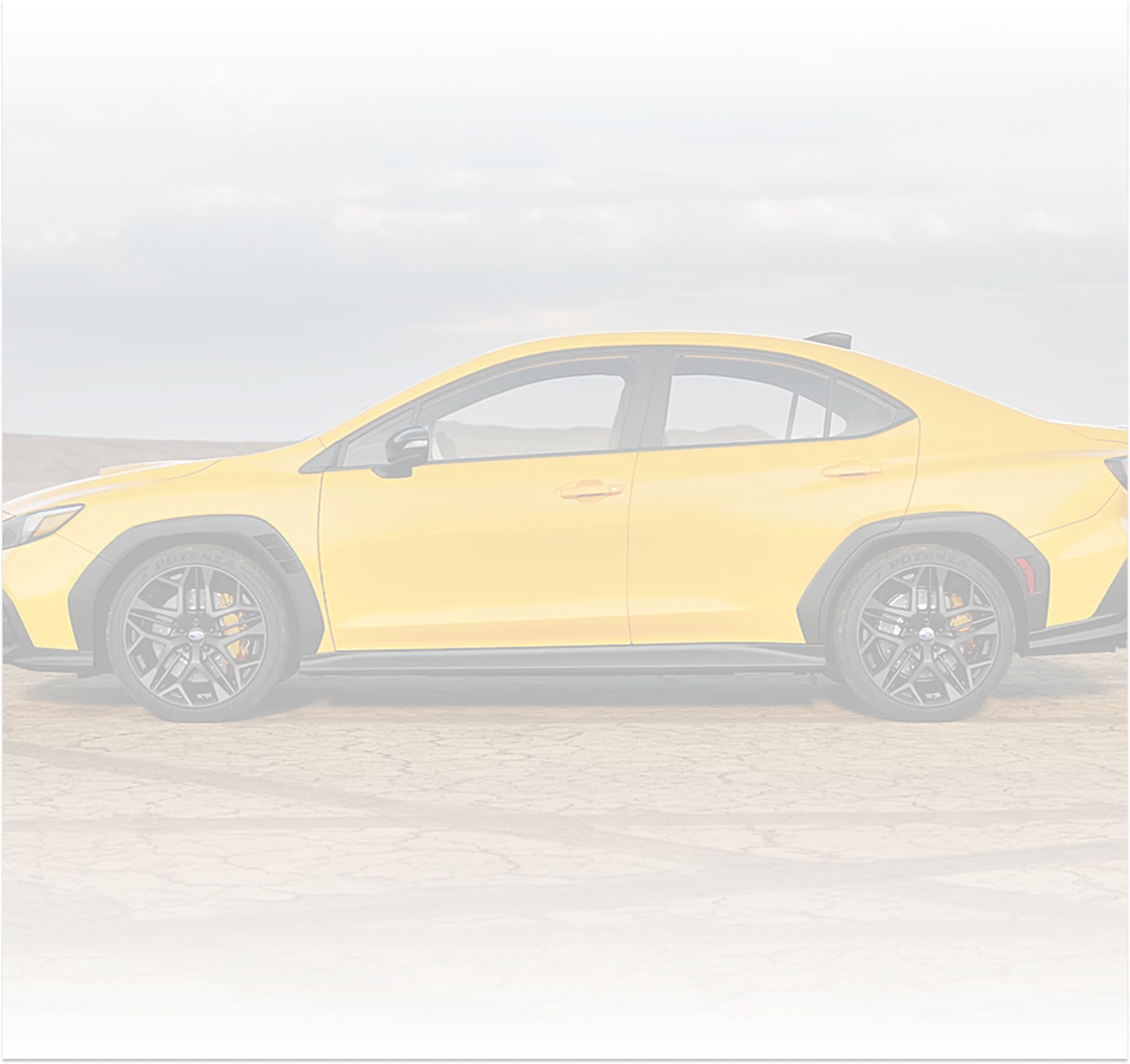A yellow Subaru WRX Series.Yellow on a race circuit