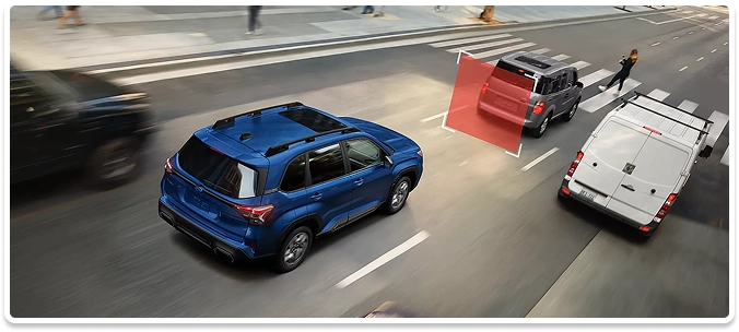 An overhead view of a blue Subaru SUV approaching a stopped vehicle at a crosswalk with a red pre-collision warning zone displayed