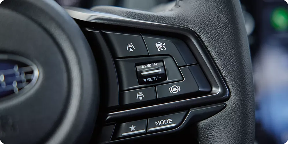 Close-up of the WRX steering wheel Drive Mode Select controls