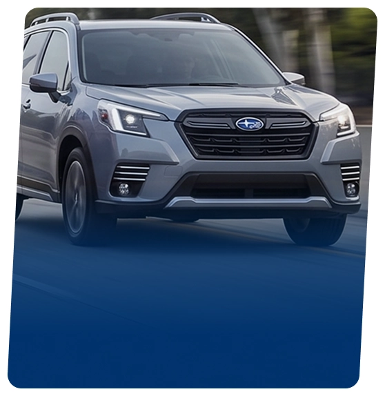 A silver Subaru Forester on a city street