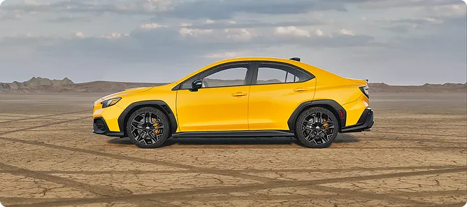 Yellow WRX Series.Yellow on track showing its matte black wheels