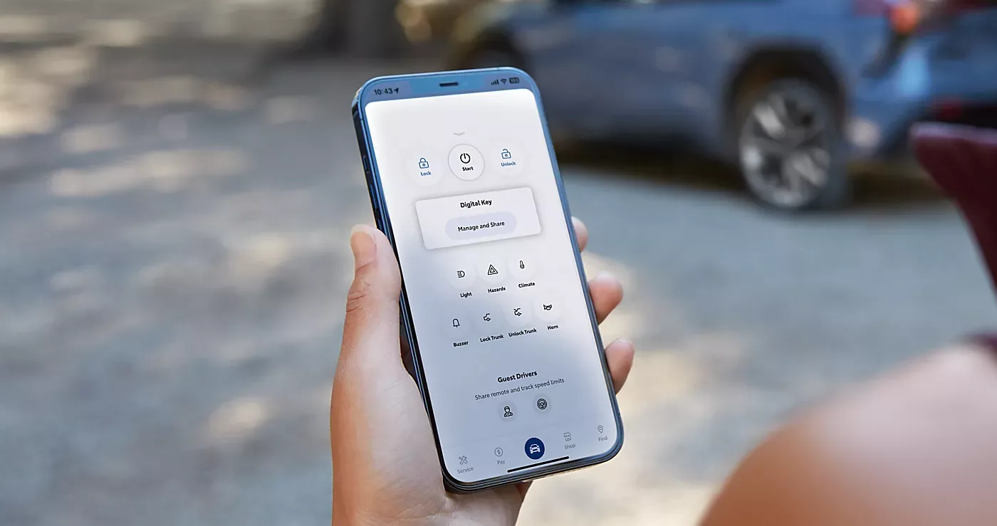 A driver unlocking a Subaru with a smartphone digital key