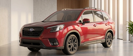 A red Subaru Forester in a bright showroom