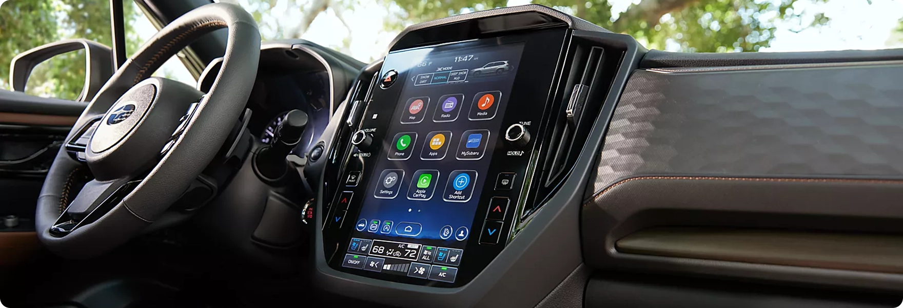 The steering wheel and large vertical Subaru Multimedia touchscreen on the dashboard of a 2026 Subaru Forester
