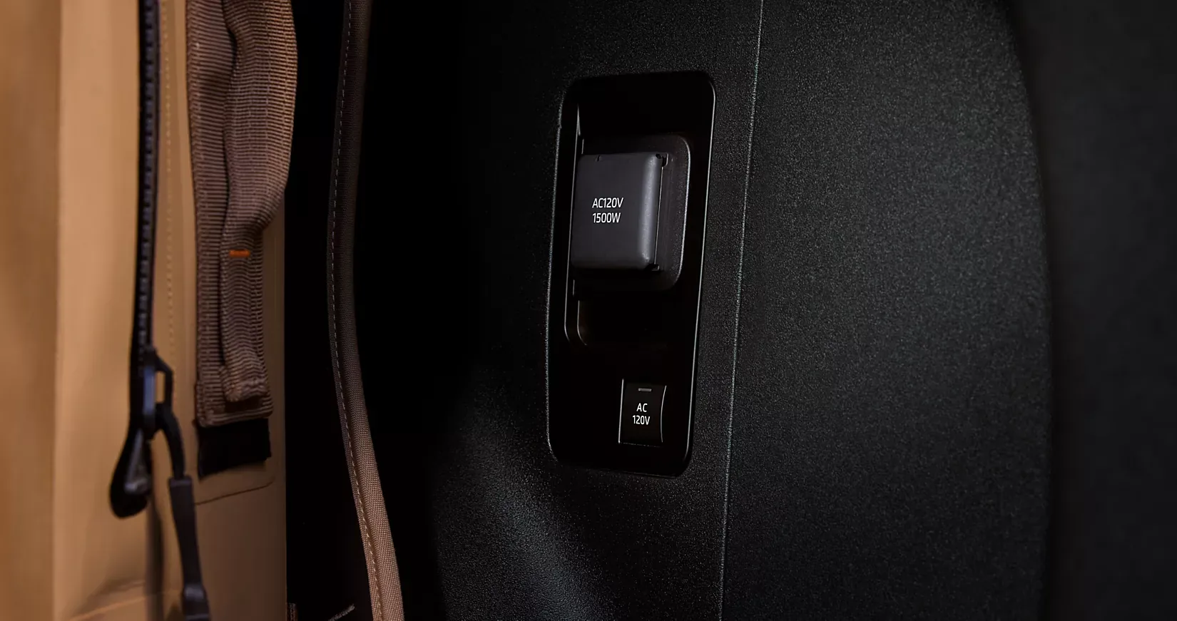 Cargo tie-down hook and USB port detail in the Solterra cargo area