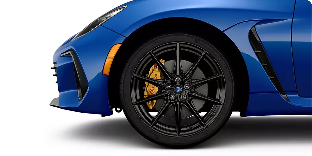 Profile of a blue Subaru BRZ tS showing its dark alloy wheels