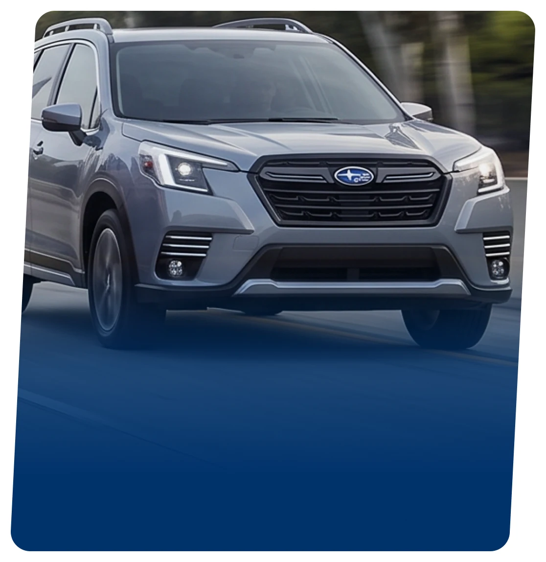 Grey Subaru electric SUV on a blue backdrop
