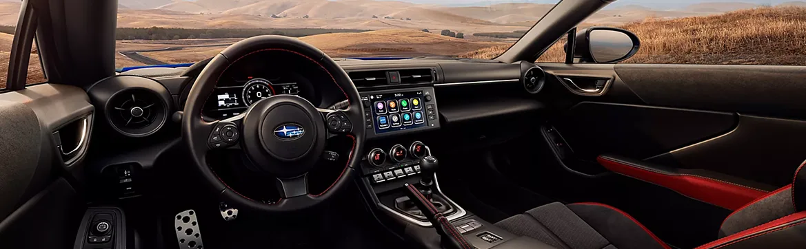 Driver’s side view of the BRZ cabin with red-accented seats