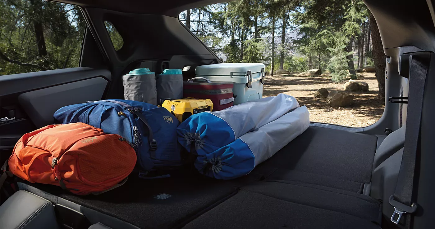 The 2026 Subaru Solterra cargo area loaded with duffel bags and camping gear