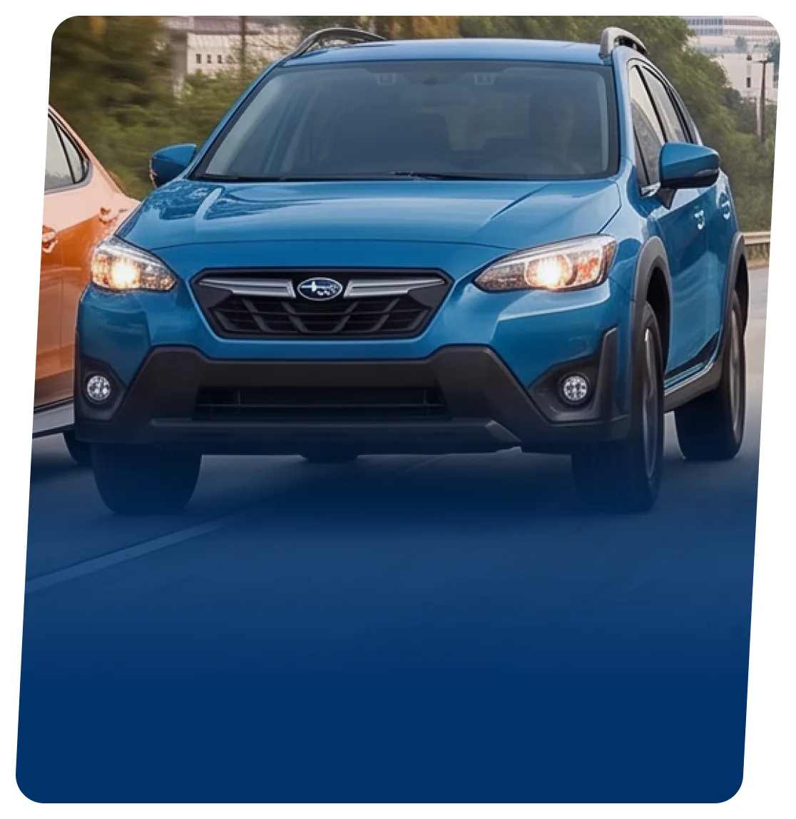 Blue Subaru Crosstrek SUV on a blue backdrop