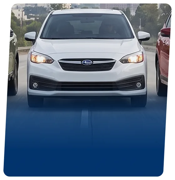 White Subaru Impreza hatchback on a blue backdrop