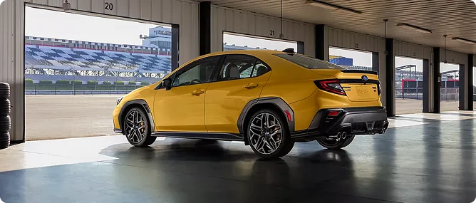 Yellow WRX Series.Yellow parked in a pit garage