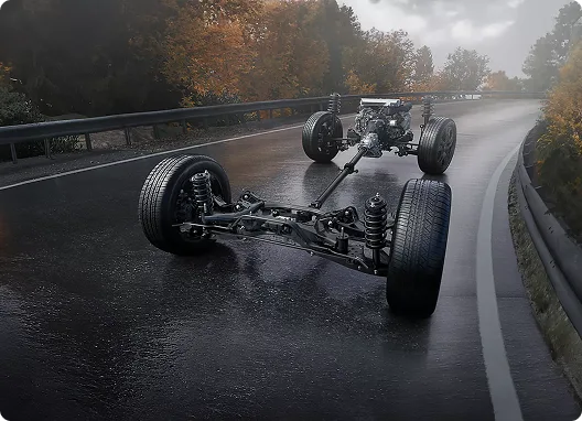 Cutaway view of the Subaru Symmetrical All-Wheel Drive powertrain on a wet road