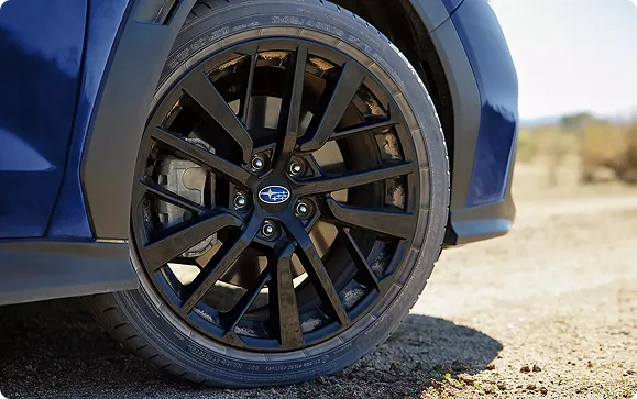 Close-up of a multi-spoke WRX alloy wheel