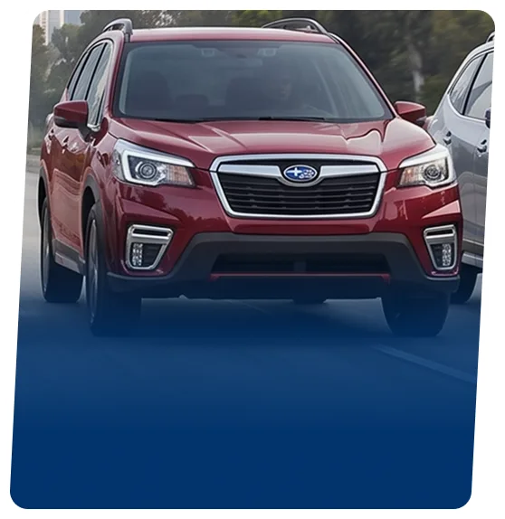 Red Subaru hybrid SUV on a blue backdrop