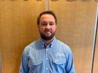 Staff member Caleb Cox from ID_889584