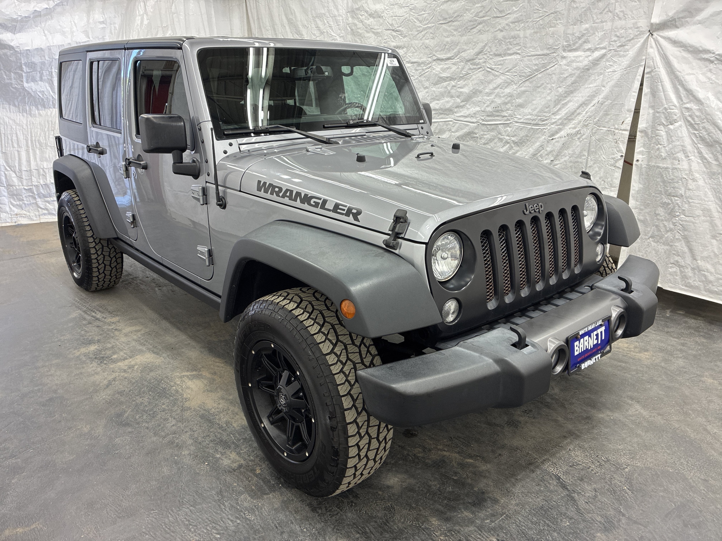 Used 2016 Jeep Wrangler Unlimited Black Bear with VIN 1C4BJWDG2GL137014 for sale in Saint Paul, Minnesota