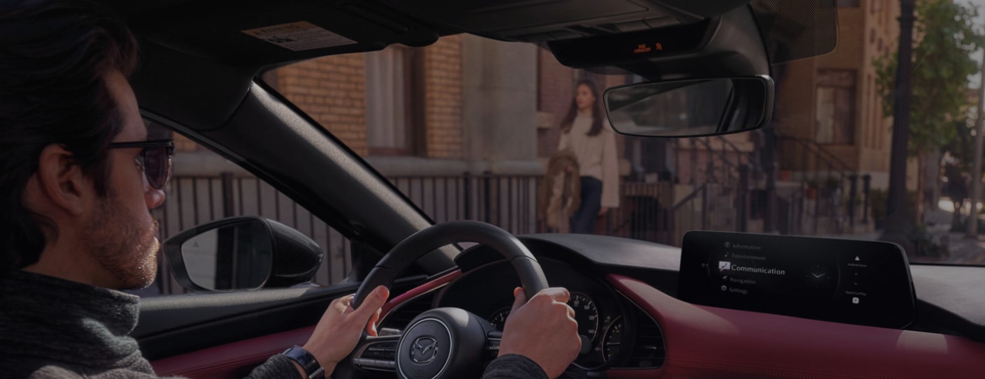 Person cheerfully signing documents.