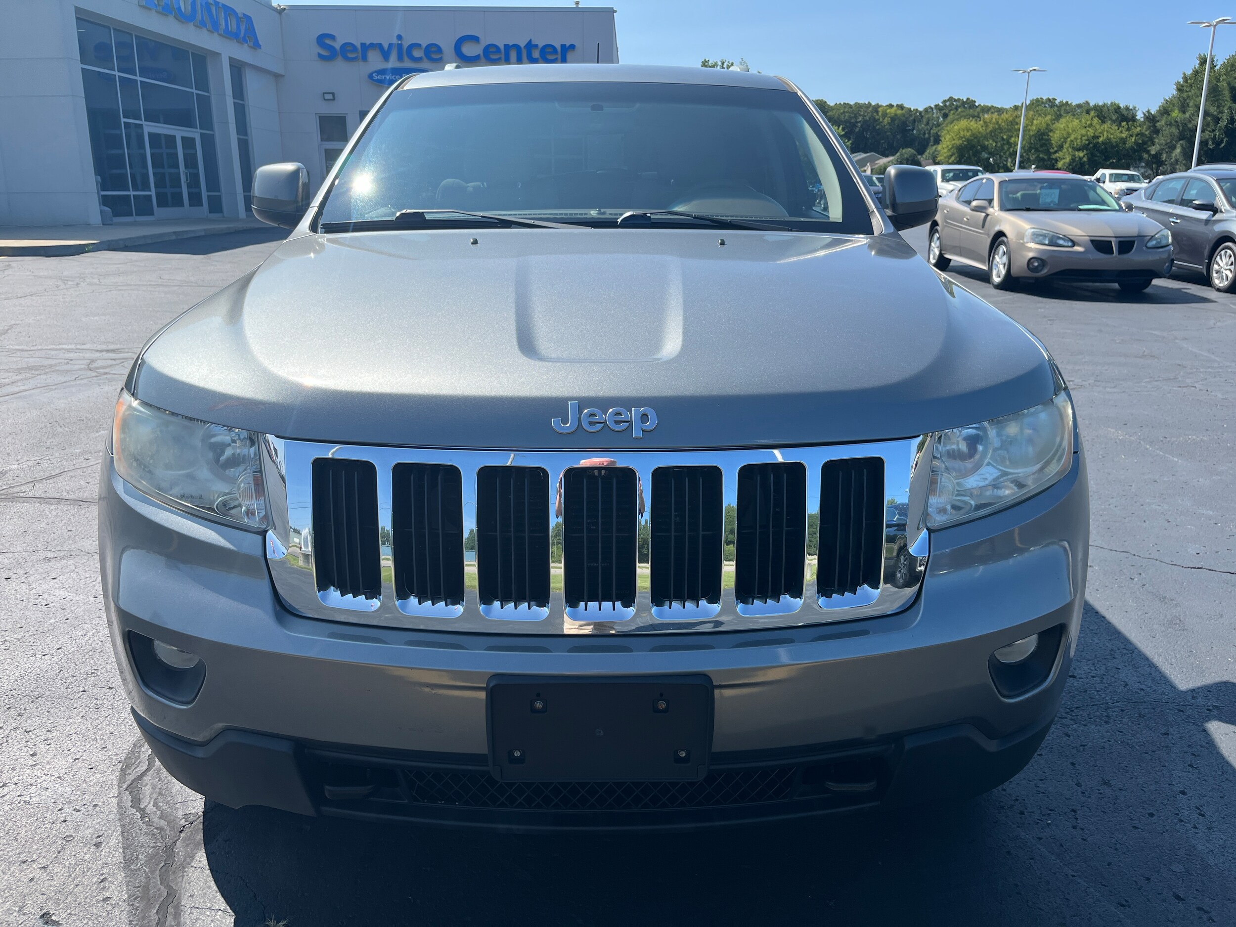 Used 2011 Jeep Grand Cherokee Laredo with VIN 1J4RR4GG0BC712981 for sale in Battle Creek, MI